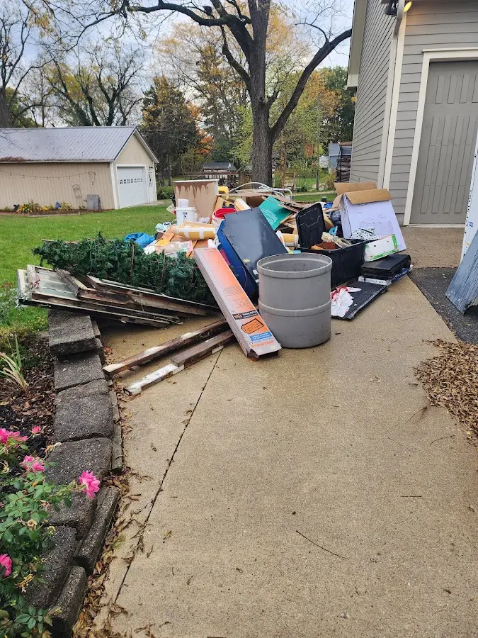Dumpster being loaded with debris for Commercial Dumpster Rental in East Stroudsburg